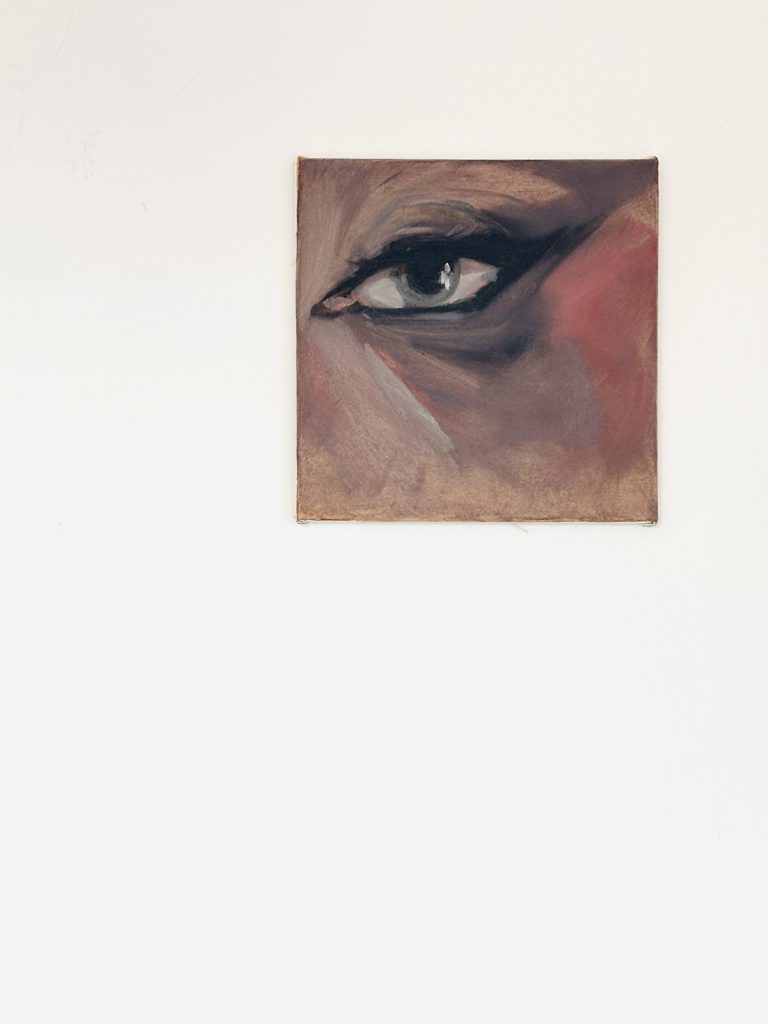 Tired Smoky at the Night Club, 30x30 cm, oil on canvas, 2026, A close-up study of a woman's eye with smudged dark makeup, evoking a 'smoky eye' aesthetic. The color palette is muted and earthy, dominated by tones of gray, bruised brown, and deep shadows. The gaze is exhausted and melancholic, rendered with raw, textured brushwork that emphasizes a sense of artificiality and fatigue.