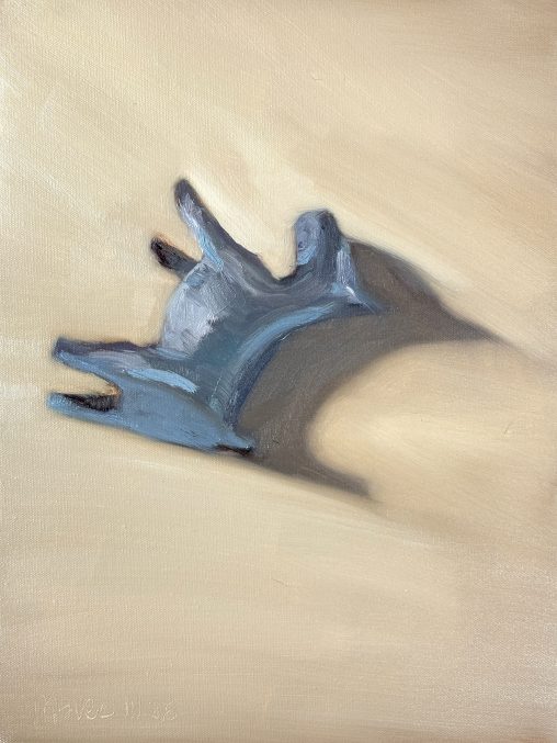 Oil painting, 30x40 cm. A clinical study of a Monopoly dog token, lying on its back in a position suggesting death or total surrender. The figure is rendered in cold blue and grey tones, casting a long, heavy shadow across a flat, ochre-tinted background. The composition emphasizes the stiffness of the object, stripping the toy of its playful context.